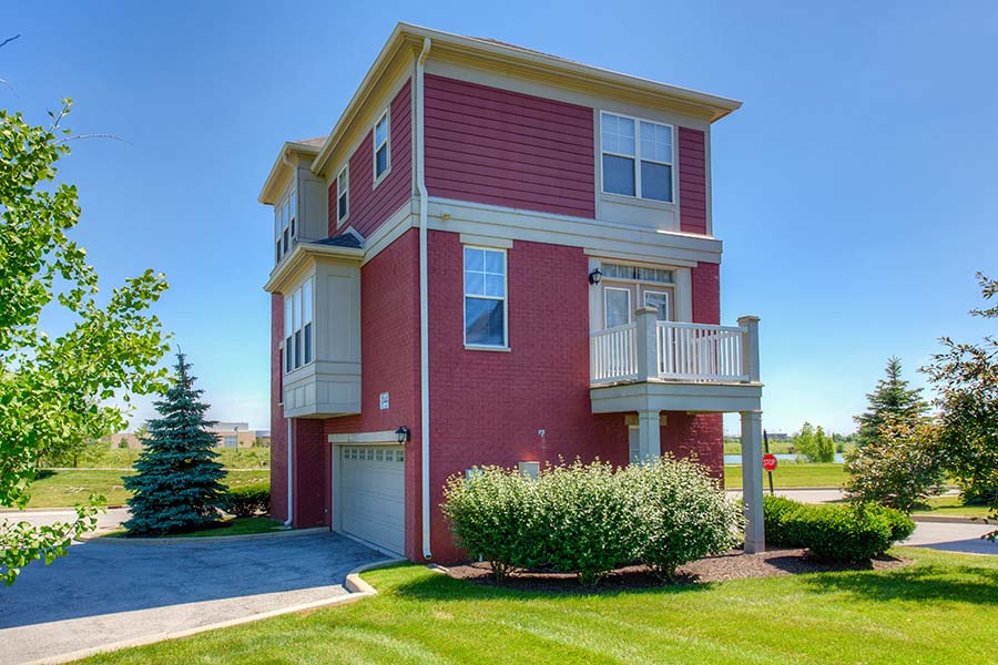 Red brick exterior of a townhome at The District At Saxony