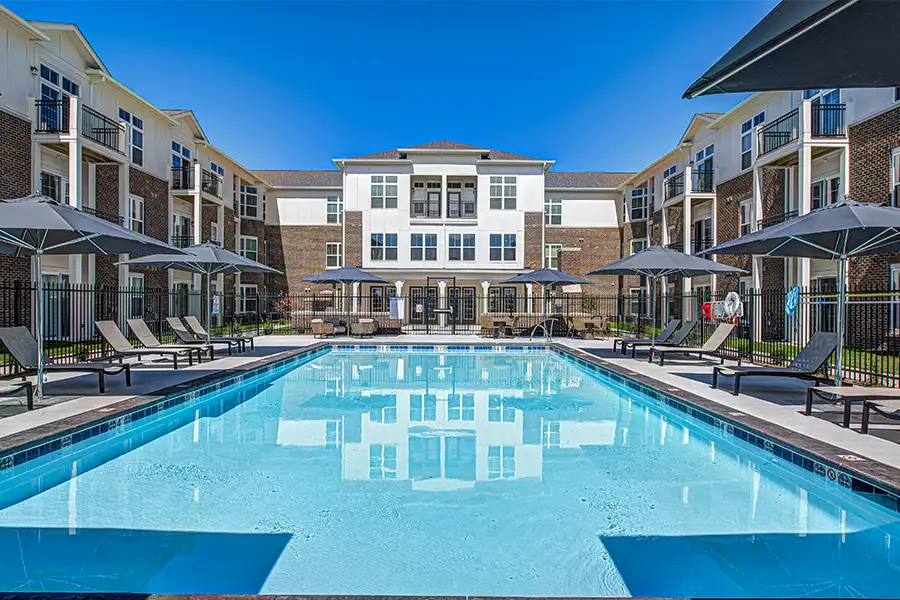 Not sure what a community means by amenities? This pool at Bayshore Apartments is one example of an amenity. Pristine pool surrounded by apartment buildings at Bayshore Apartments.